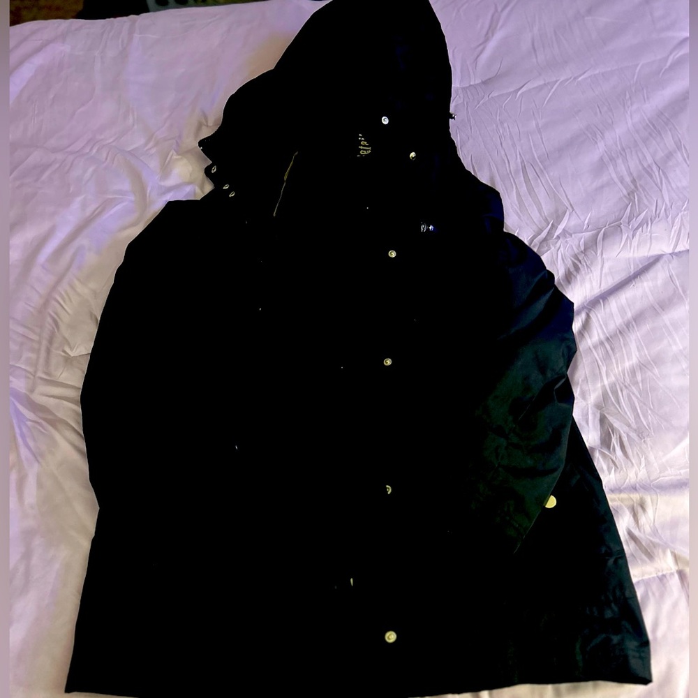 Black coat with a hood. Goes right before the knees. Size 3X.